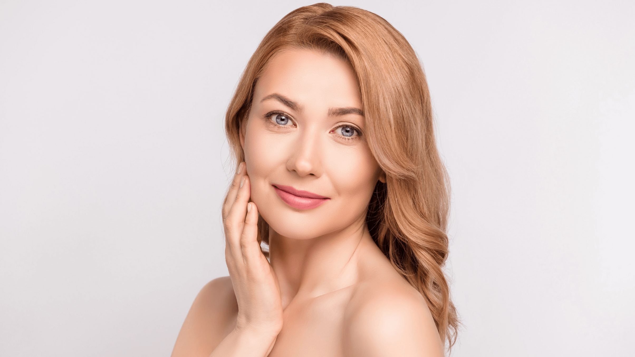woman touching her face
